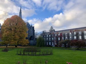 Photograph of Maynooth University south campus. Stone buildings and trees.